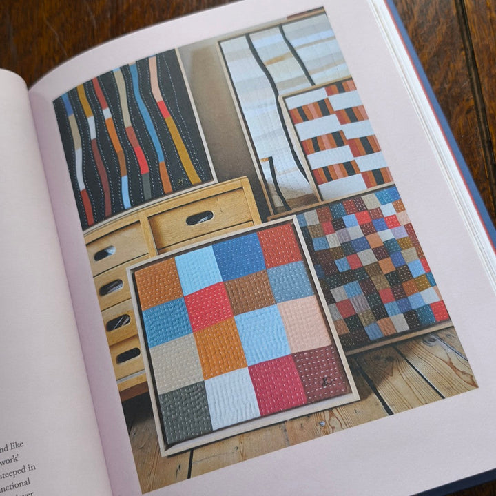 Colorful quilt patterns displayed on a book page
