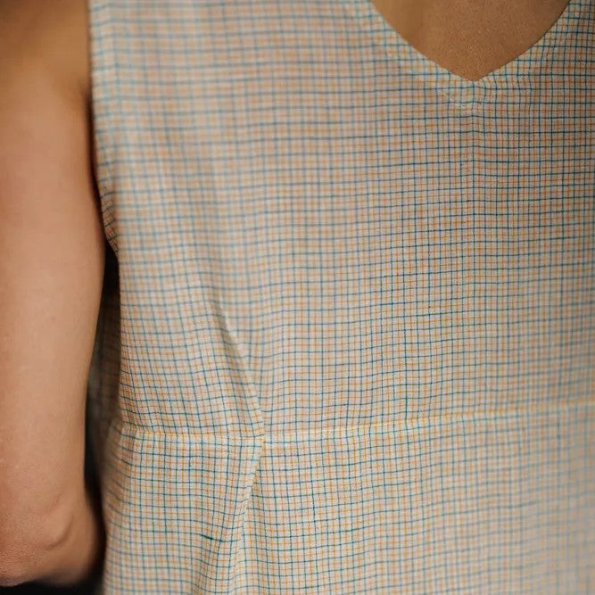 Close-up of a checkered dress with a neutral background